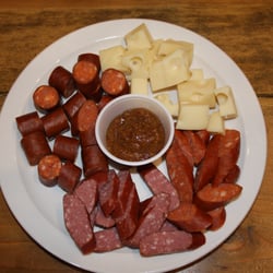 Wurstteller (Sausage platter) 3 smoked sausages like Landjaeger, Debriziner and Kilometer. Served with Swiss Cheese and sweet mustard.
