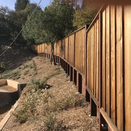 Redwood fencing along backyard. Redwood fencing along backyard.