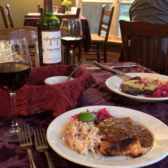 Ronnie's Real Food Bistro - Our main courses- my boyfriend ordered the steak and I got the salmon. - New American Near Me - Austin, Texas Ronnie's Real Food Bistro - Our main courses- my boyfriend ordered the steak and I got the salmon. - New American Near Me - Austin, Texas