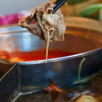 LaMei Hot Pot - chopsticks holding a piece of meat - Chinese Near Me - Brookline, Massachusetts LaMei Hot Pot - chopsticks holding a piece of meat - Chinese Near Me - Brookline, Massachusetts