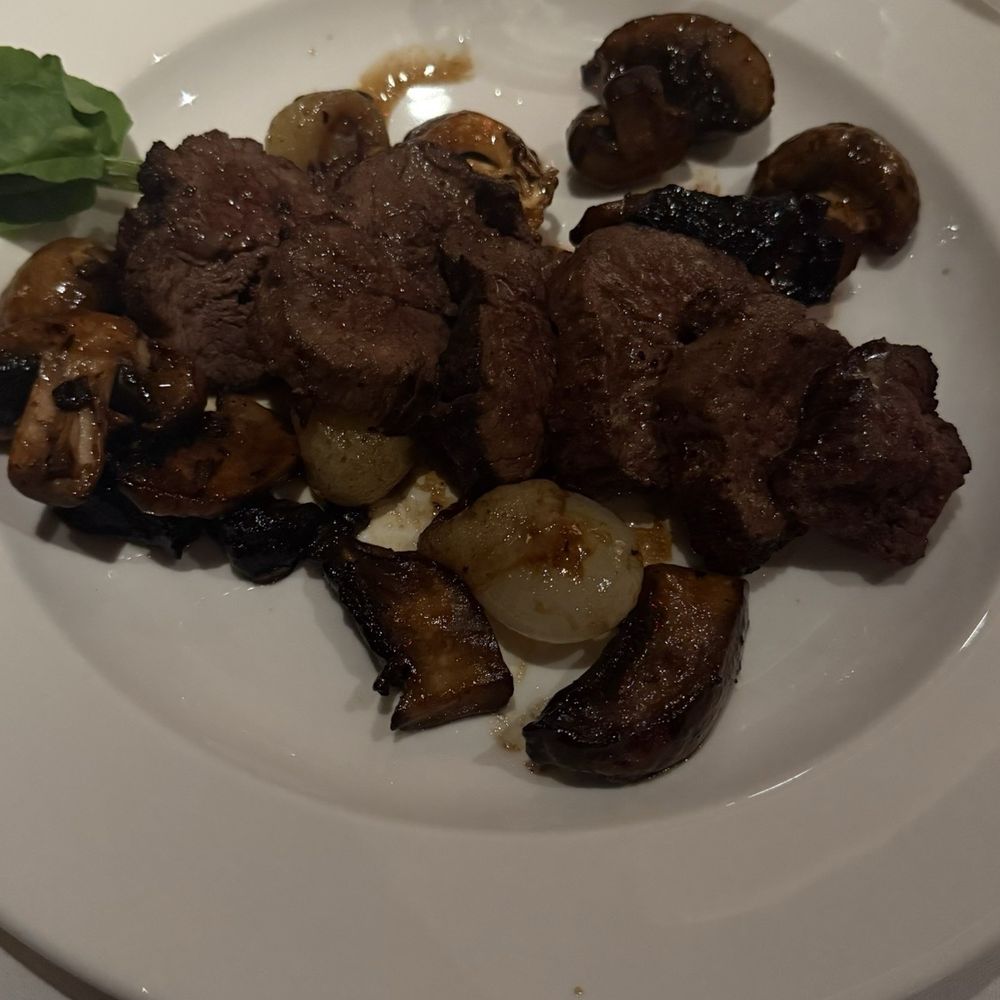 The Capital Grille - Sliced Filet Mignon with Cipollini Onions, Wild Mushrooms and Fig Essence - Steakhouses Near Me - Burbank, California The Capital Grille - Sliced Filet Mignon with Cipollini Onions, Wild Mushrooms and Fig Essence - Steakhouses Near Me - Burbank, California