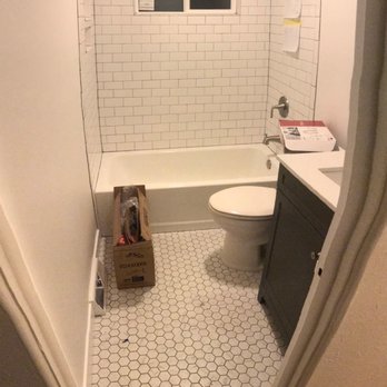 Sheaffer Bros. Construction - a bathroom with a tub and toilet - General Contractors Near Me