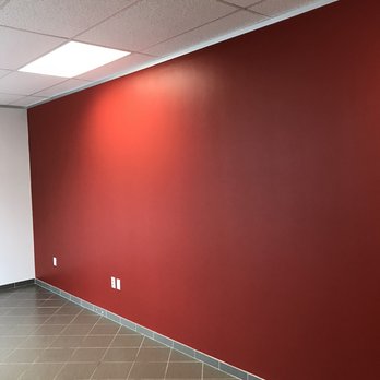 Houston Painters Pro - We were hired to paint an accent wall for a corporate office in Houston.  The color red can be quite a challenge to get it to look right. - Painters Near Me