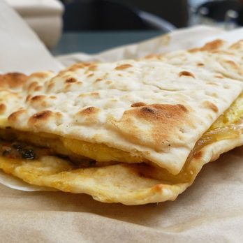 Caribou Coffee - Just Egg roasted tomato and pesto flatbread ($7), vegan by default. Not bad. Hearty, albeit a bit oily. Decent-tasting cheese. - Coffee & Tea Near Me - St. Paul, Minnesota