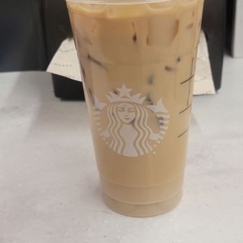 Starbucks - a cup of iced coffee on a table - Coffee & Tea Near Me - Maplewood, Minnesota Starbucks - a cup of iced coffee on a table - Coffee & Tea Near Me - Maplewood, Minnesota