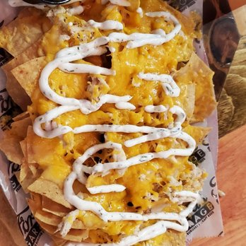 Ford's Garage Dearborn - Chicken Nacho appetizer - Burgers Near Me - Dearborn, Michigan Ford's Garage Dearborn - Chicken Nacho appetizer - Burgers Near Me - Dearborn, Michigan