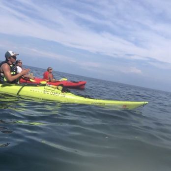 Pictured Rocks Kayaking - Our guide Charlie telling us some of the history of the area. - Tours Near Me - Munising, Michigan Pictured Rocks Kayaking - Our guide Charlie telling us some of the history of the area. - Tours Near Me - Munising, Michigan