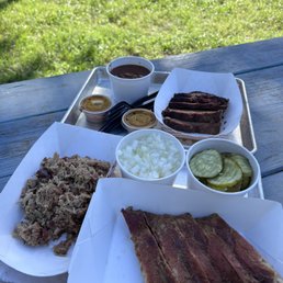 a variety of meats and sides a variety of meats and sides
