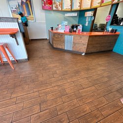 Tropical Smoothie Cafe - Everybody sitting down, most of them got up when we came in there after we was standing there waiting.