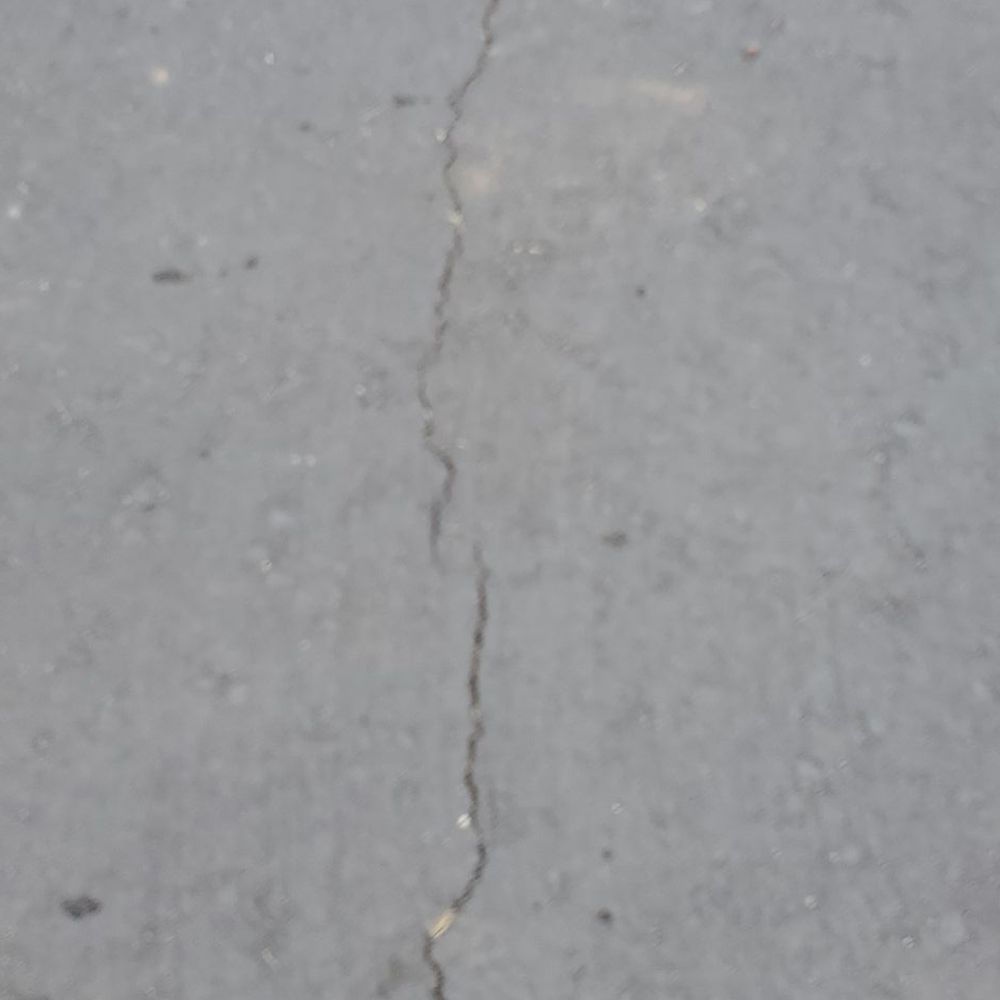 Cracks after a couple months of new asphalt. Cracks after a couple months of new asphalt.