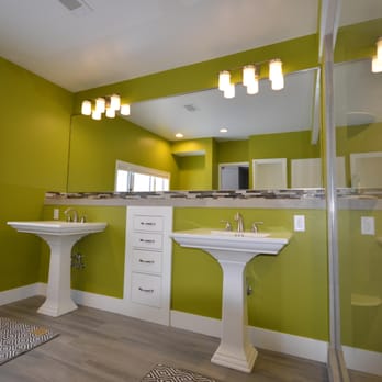 Lyons 5 - a bathroom with green walls and white fixtures - General Contractors Near Me - Rockford, Michigan Lyons 5 - a bathroom with green walls and white fixtures - General Contractors Near Me - Rockford, Michigan