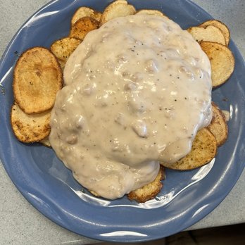 Cowboy Surfer Grill - RP Risin' Country Fried Stake, over Papás Potatoes smothered in country gravy. - Breakfast & Brunch Near Me - Corona, California Cowboy Surfer Grill - RP Risin' Country Fried Stake, over Papás Potatoes smothered in country gravy. - Breakfast & Brunch Near Me - Corona, California