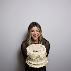 Elate Occasions - Birthday Girl glowing with the Glam Luxe Experience Photobooth against the pure white signature collection backdrop