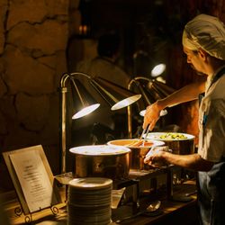 Cast & Cut - Chef serving dinner at Cast & Cut restaurant.