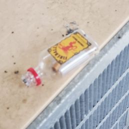 Nip with a cigarette but left on an AC unit!  Left by who I assume to be the maintenence man who was smoking and sitting outside the room.