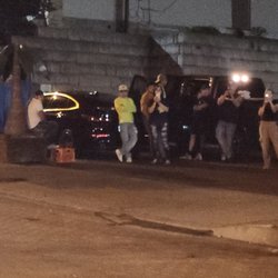 Las Palmas employees and owners hanging in parking lot after they engaged in a group street fight after business hours