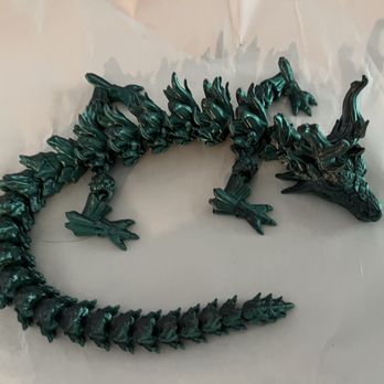 Kelly's Resale and Collectibles - Super long and wiggly shiny dark teal dragon. I tried to leave without it and just couldn't. - Used, Vintage & Consignment Near Me - High Ridge, Missouri Kelly's Resale and Collectibles - Super long and wiggly shiny dark teal dragon. I tried to leave without it and just couldn't. - Used, Vintage & Consignment Near Me - High Ridge, Missouri