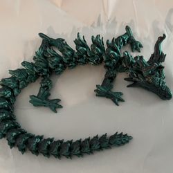 Kelly's Resale and Collectibles - Super long and wiggly shiny dark teal dragon. I tried to leave without it and just couldn't.