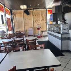 Kenny's Ribs & Chicken - The windows are all boarded up Too! Yuk!