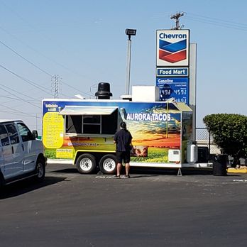 Aurora Tacos - a man standing in front of a food truck - Tacos Near Me - Santa Nella, California Aurora Tacos - a man standing in front of a food truck - Tacos Near Me - Santa Nella, California