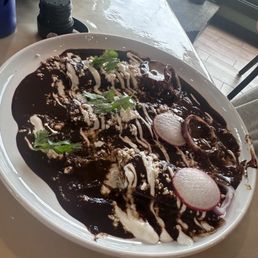 Cheese enchiladas with mole sauce Cheese enchiladas with mole sauce
