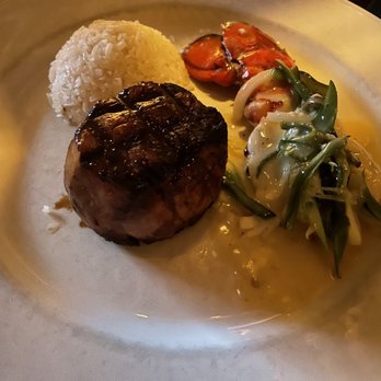 Javier's - The stake is filet minion with a lobster tail with a white cream with green vegetable slices that are with accompanied with white rice - Mexican Near Me - Irvine, California Javier's - The stake is filet minion with a lobster tail with a white cream with green vegetable slices that are with accompanied with white rice - Mexican Near Me - Irvine, California
