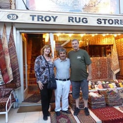 Mustafa the owner with two happy customers.