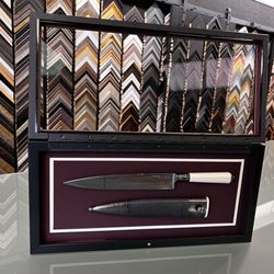 Bellingham Frameworks - Hinged front shadow box for collectors knives. Hinged front to access knives. Custom inlay and knife holders.