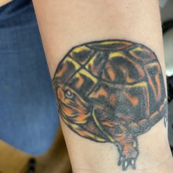 Chaos Tattooing - The breast cancer ribbon is showing through the turtle.