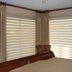 Bay Breeze Blinds - HunterDouglas Silhoette shades with custom side panels and matching duvet. Makes this guest room a great retreat.