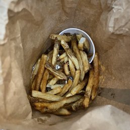 This carefully designed presentation represents $20 worth of burger and fries. This carefully designed presentation represents $20 worth of burger and fries.