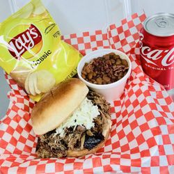 Pig & Pie - Tender, juicy pulled pork sandwich topped with made-in-house coleslaw with a side of made-in-house baked beans.