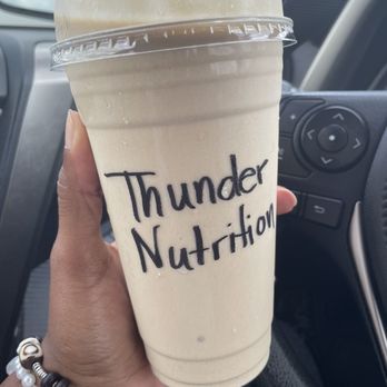 Thunder Nutrition - a hand holding a cup of coffee - Juice Bars & Smoothies Near Me - Madison, Alabama Thunder Nutrition - a hand holding a cup of coffee - Juice Bars & Smoothies Near Me - Madison, Alabama