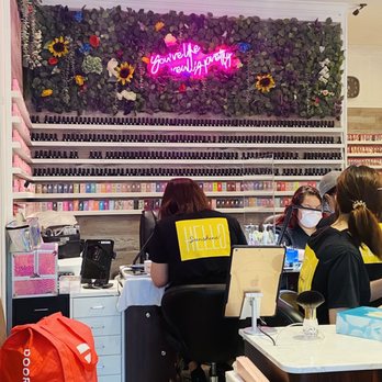 Sunshine Nails - salon interior and nail polish varieties. - Nail Salons Near Me - Alexandria, Virginia