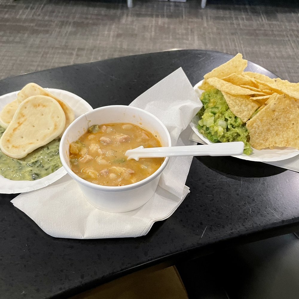 Admirals Club PHX - White chili, guacamole and chips, pita bread and spinach dip. - Airport Lounges Near Me - Phoenix, Arizona