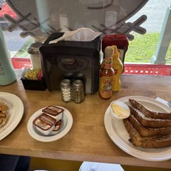 The Cacklin' Hen - French toast & sausage, egg, and cheese on a roll.