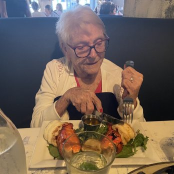 Mussel Beach Restaurant - Grandma enjoying her lobster tails - Seafood Near Me - Delray Beach, Florida Mussel Beach Restaurant - Grandma enjoying her lobster tails - Seafood Near Me - Delray Beach, Florida