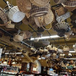 Lombardi's Gourmet Market - Wicker baskets hanging from the ceiling