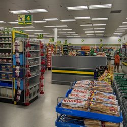 Dollarama - Checkout, both human and self-checkout kiosks