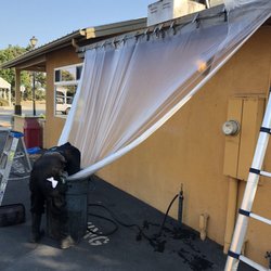 Expert Steam Cleaning - Catching dirty water off the roof.