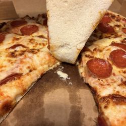 Village Pizza - Raw undercooked pepperoni pizza