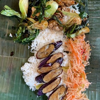 Bonifacio - Top: bok choy + chicken  Bottom: eggplant + atchara  Under it all: garlic rice on banana leaves - Filipino Near Me - Columbus, Ohio