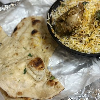Tandul Indian Cuisine - Chicken Dum Biryani and a side of butter naan -- 7 March 2026 - Indian Near Me - Parma Heights, Ohio Tandul Indian Cuisine - Chicken Dum Biryani and a side of butter naan -- 7 March 2026 - Indian Near Me - Parma Heights, Ohio
