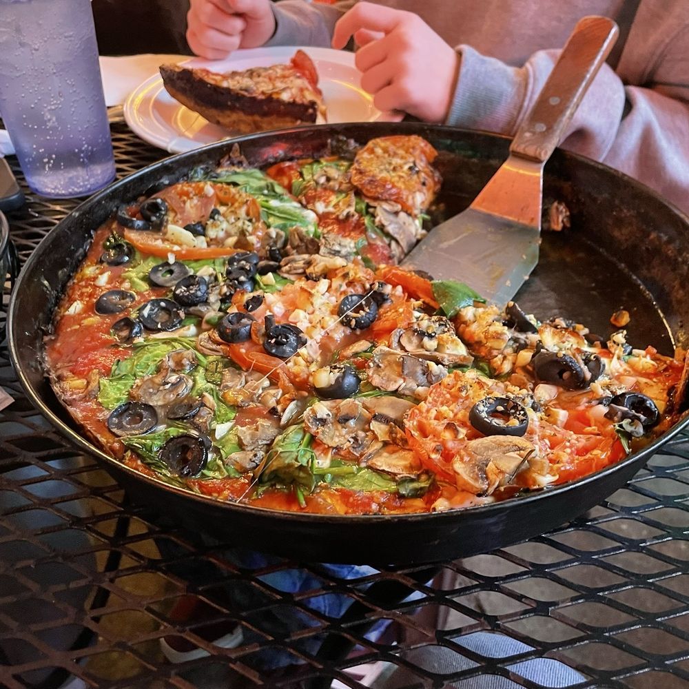 Large pizza w/ garlic, black, olives, mushrooms, tomatoes, and spinach.
