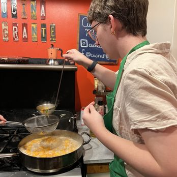 Cucina Migrante - Taking turns adding broth to the risotto - Personal Chefs Near Me - San Diego, California Cucina Migrante - Taking turns adding broth to the risotto - Personal Chefs Near Me - San Diego, California