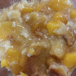 Portion of delicious peach cobbler
