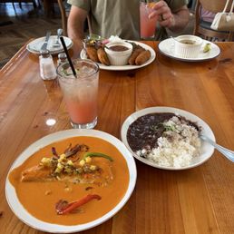 Rockfish in a yummy sauce that came with rice a beans.