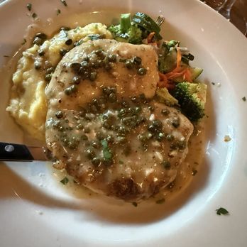 The Tin Lantern Bar & Grill - The chicken piccata is a solid choice. Served with a generous side of mashed potatoes and vegetables - New American Near Me - Meadow Vista, California The Tin Lantern Bar & Grill - The chicken piccata is a solid choice. Served with a generous side of mashed potatoes and vegetables - New American Near Me - Meadow Vista, California