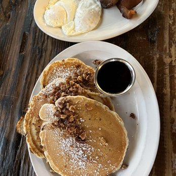 Bramble - 3 Sirens Restaurant Group - Bourbon & Pecan pancakes w/ over easy eggs and bacon - Breakfast & Brunch Near Me - Tulsa, Oklahoma