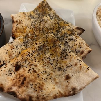 Flora Indica Chelsea - Cheese naan w poppyseeds - Bars Near Me - London, XGL Flora Indica Chelsea - Cheese naan w poppyseeds - Bars Near Me - London, XGL